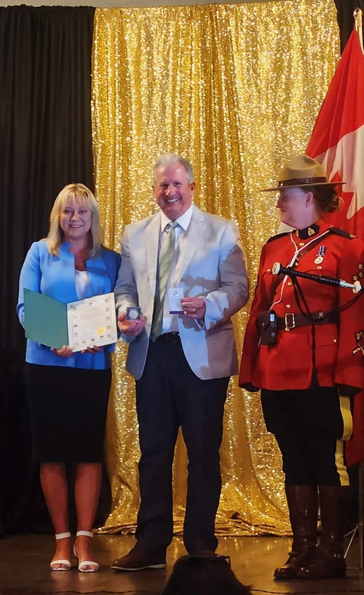 MP Tracy Gray presenting Queen Platinum Jubilee Pin to Michael J. Ballingall